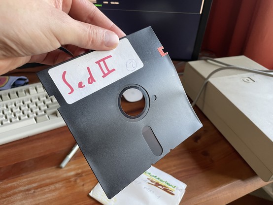 Front view of a very bent floppy disk
